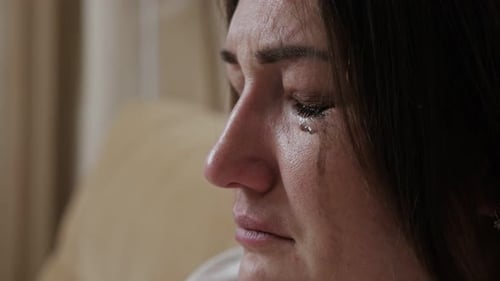 Woman with Tears Streaming Down Her Face