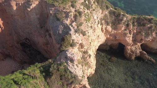 Aerial view of rocks on the ocean shore