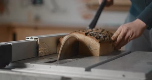 Carpenter Saws Logs on a Circular Saw in His Workshop Making of the Planks Slow Motion Carpentry