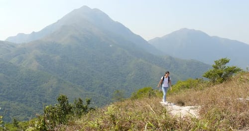 Woman go hiking on mountain