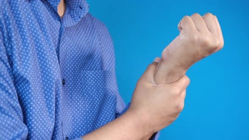 Man Suffering Pain in Hand Close Up