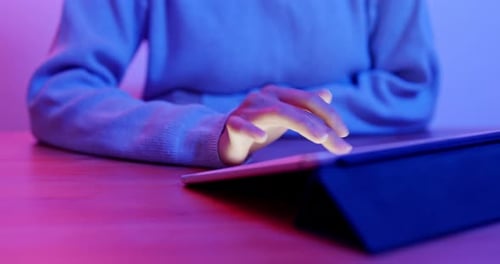 Woman use of tablet computer at home