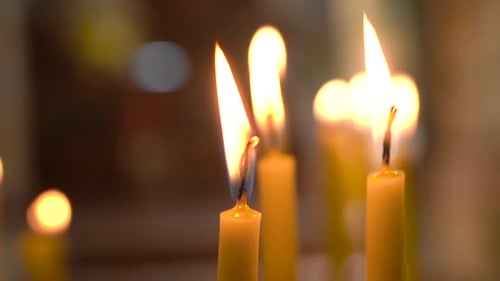 Two Candles Slowly Burning Inside of Church, 100 Frames Per Second