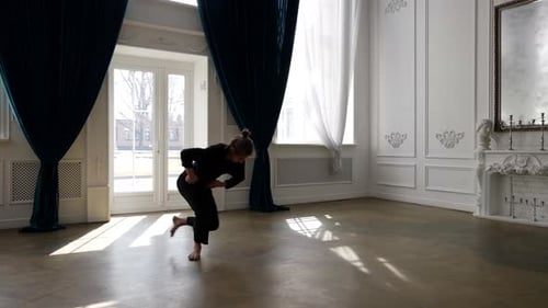 Male Ballet Dancer is Dancing Contemporary Choreography Young Man is Rehearsing Alone in Hall