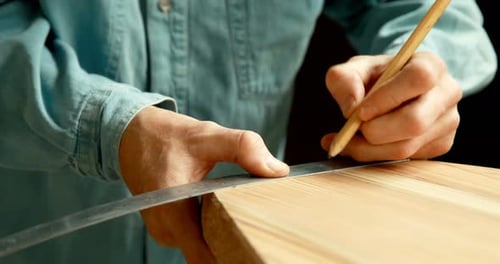 Man making surfboard 4k