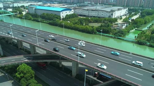 Aerial Drone Orbital View of Highway Multilevel Junction Road with Moving Cars at Daytime