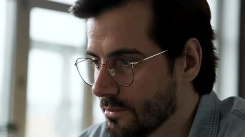 Man With Glasses Looking at Computer Screen Close Up