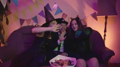 Friends in Costume Celebrate Halloween with a Selfie