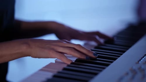 Woman Playing Piano Keyboard Close Up