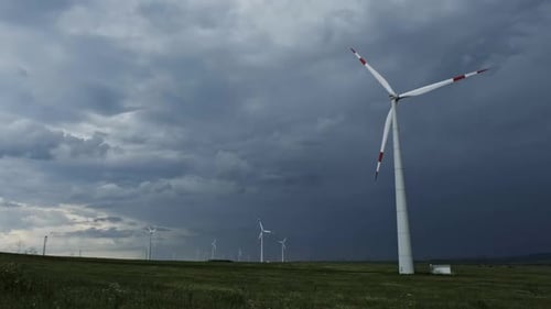 Windmill or Wind Turbine on Wind Farm in Rotation
