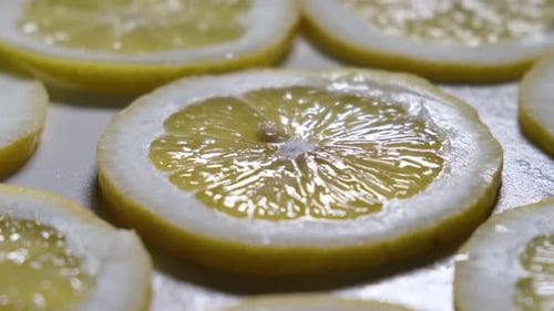 Rotate Sliced Yellow Lemon in a Circle
