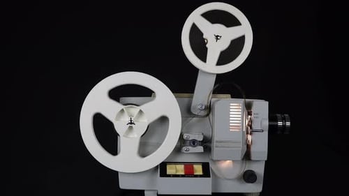 Vintage Film Projector Operating in Dark Environment
