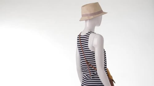 Mannequin in Striped Top Turning.