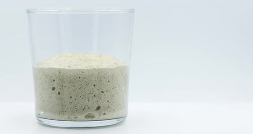 Time Lapse of Dough Rising in Glass Container