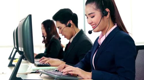 Business People Wearing Headset Working in Office