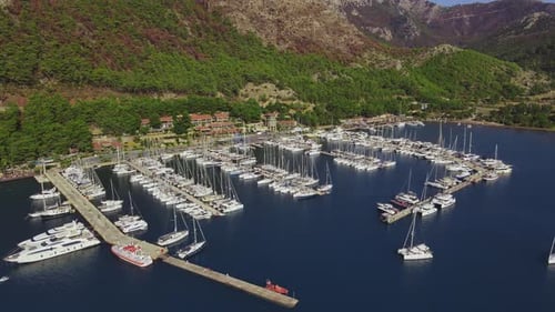 Yachts Docked on Pier in Yacht Club in Marine Bay