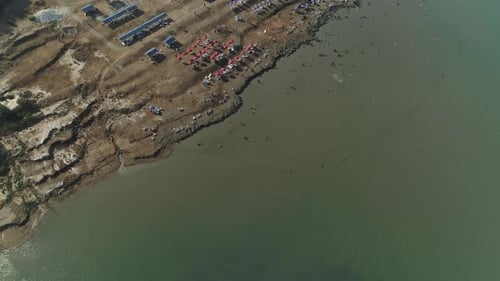 Aerial View of People Enjoying a Crowded Shore