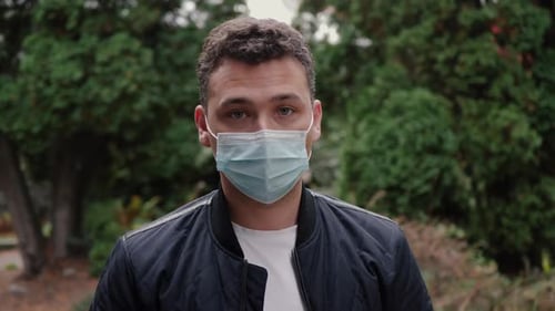 Man Wearing Surgical Mask in Natural Setting