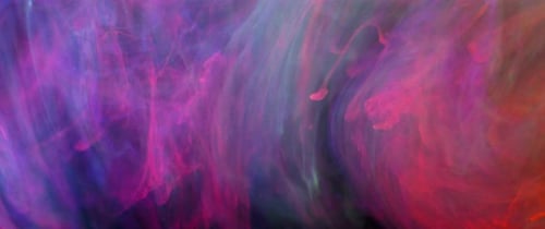 Macro Shot of Colorful Liquid Mixing and Spreading