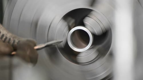 Removing the Sharp Edge From the End of the Cylindrical Part Using a Hand Tool.