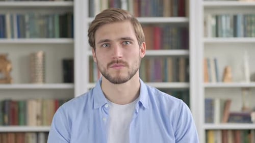 Man Reacts with Surprise and Covers Mouth