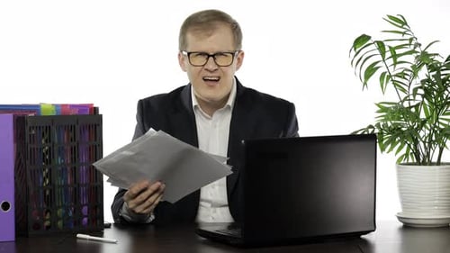 Businessman Working in Office. Negative Amazed of Reading Paper Full of Mistakes