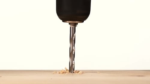 Drill Bit Drilling Into Wood