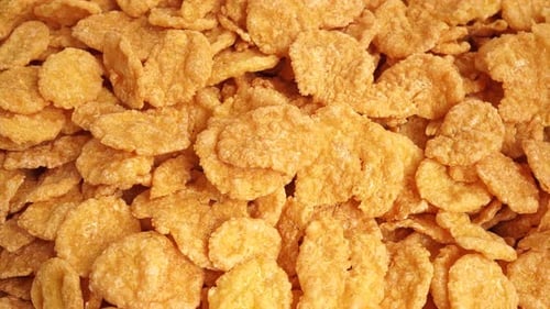 Pile of Crunchy Golden Brown Corn Flakes Cereal