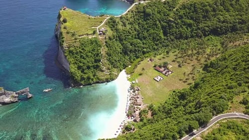 Small Beach between Green Rocks