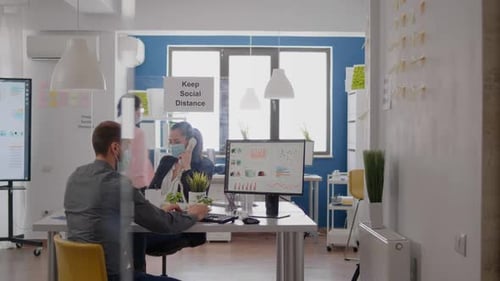 Modern Office with Social Distancing and Masks