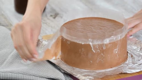 Pastry Chef Remove the Acetate Strips From Chocolate Mousse Cake.