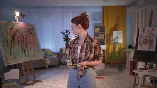 Female Artist in Art Studio Holding Palette