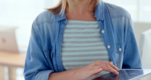 Woman Using Tablet Device in Modern Workplace