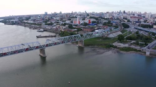 Train Travels Along the Railway Bridge Across the Ob River in Novosibirsk