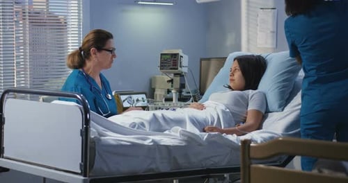 Doctor Visiting Patient in Hospital