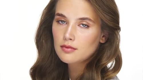 Attractive Woman Smiling at the Camera in Studio