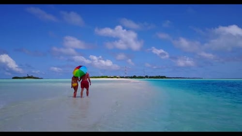 Romantic couple suntan on luxury shore beach holiday by blue ocean with white sand background of the