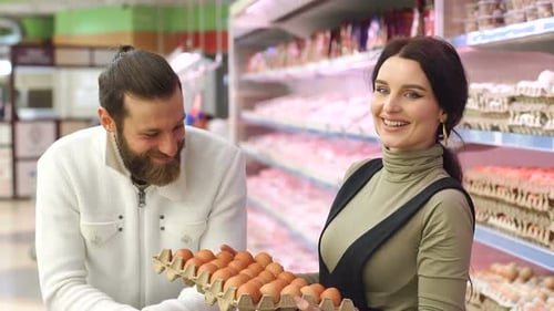 Young Family Buying Eggs at the Grocery Store