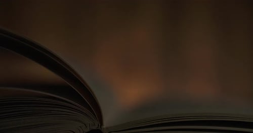 Pages Turning Quickly in an Open Book