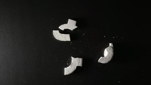 TOP VIEW Gypsum US Dollar Symbol Falls And Breaks Slow Motion