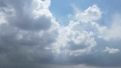 White Clouds Drifting Across Blue Sky Time Lapse