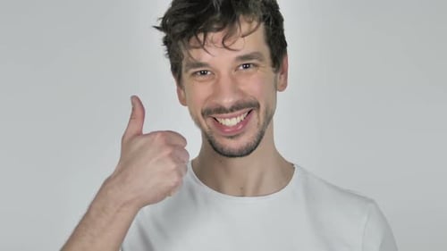 Smiling Man Gives Thumbs Up of Approval
