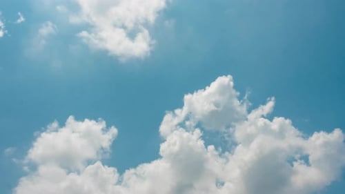 White Clouds Moving in a Blue Sky Time-Lapse