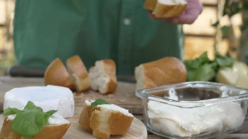 Close Up Spreading Cream Cheese on Bread