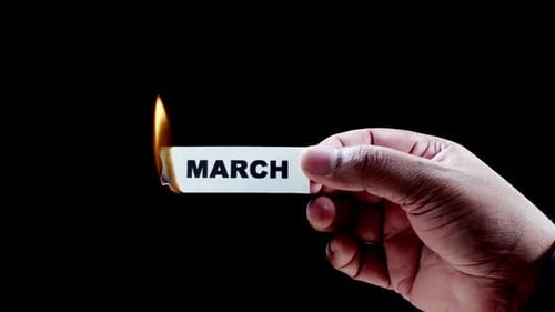 Burning Card with March printed on it