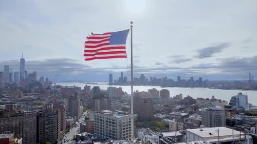 Aerial View of Cityscape with American Flag