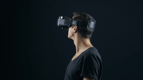 Young Adult Wearing VR Headset in Studio