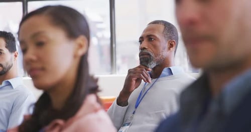 Group Attending Business Meeting in Bright Office