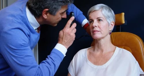 Eye Exam With Ophthalmoscope by Medical Professional