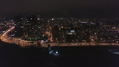 Night Aerial View on Panorama of Amazing Megapolis with Lights in Windows of High Buildings